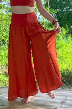 Long flowy Persephone Palazzo Pants come in one size, fits sizes 0-14. Soft stretchy viscose waist band can be worn high or folded over. Pull string around hips created snug fit for smaller body sizes. Available in Onyx, Sage and Rust. Ethically handmade of tree pulp eco Lyocell fabric its silky, luxurious and stunning, also known as vegan silk. Matching Bell Sleeve Lily Tops, Halter Tops, and Tube Tops make gorgeous eco outfits. Mix and match styles and colors. Persephone Pants, Tribe Clothing, Lyocell Fabric, Gorgeous Outfits, Tube Tops, Halter Tops, Matching Top, Palazzo Pants, Body Size