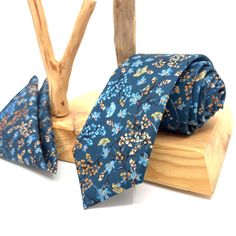 "Flower Navy Blue Neck Ties / Wedding Neck Ties / Mens Necktie / Groomsmen Necktie / Pocket Square Set / Neck Tie For Men/ Neck Tie This navy blue tie has a unique style with floral patterns of various colors on it. It is a unique handmade tie that you can only find on this page. You can either gift this hand-made Flower Navy Neck Ties or you can use it yourself to feel different on your special days. Please include your size option for the bow tie in your order notes. Otherwise, Adult size will Blue Ties For Father's Day, Dapper Ties For Groom On Father's Day, Blue Suit And Tie Accessories For Groom, Groom Ties For Father's Day, Blue Ties With Pocket Square For Wedding, Dapper Blue Ties For Groom, Blue Ties And Pocket Square For Groom, Blue Tie With Pocket Square For Groom, Blue Groom Suit Accessories With Pocket Square