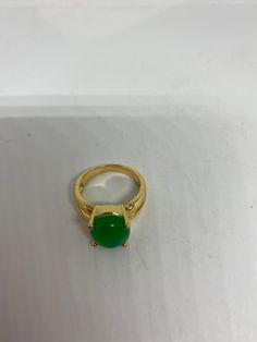 Vintage Lucky Green Nephrite Jade ring Fun jade is color enhanced Large green nephrite jade Ornate German Gold finished Vintage ring, does not tarnish, NOT sterling Size 6.5, 7 or 9 All rings are shipped free in the US in a nice gift box. Check out our over a THOUSAND great reviews Engraving is $4 per letter and is not always perfect depending on the piece. It can take a few days if the jeweler is busy. This is payable to Paypal Judithsltd@gmail.com Formal Green Cabochon Rings, Green Cabochon Round Stone Rings, Gold Jade Emerald Ring, Green Emerald Crystal Ring, Green Emerald Cabochon Rings, Green Jade Round Stone Jewelry, Green Crystal Gemstone Ring, Green Jade Jewelry With Round Stone, Green Gemstone Crystal Ring