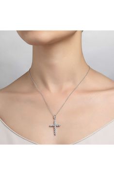 Six glittering simulated diamonds add dazzling dimension to this hand-polished cross-pendant necklace that makes a treasured keepsake. 20" length; 5/8"W x 7/8"L pendant Total simulated-diamond weight: 2.76ct. Sterling silver bonded with platinum/simulated diamond Imported Luxury Sterling Silver Cross Pendant Diamond Necklace, Brilliant Cut Sterling Silver Cross Pendant Necklace, Elegant Nickel-free Cross Pendant Necklace, Luxury Diamond-accented Pendant Cross Necklace, Nickel-free Stainless Steel Cross Pendant Necklace, Diamond Cross, Diamond Cross Pendants, Cross Pendant Necklace, Cross Pendant