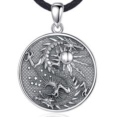 Dragon Pendant Vintage Sterling Silver Sun &amp; Moon Amulet Necklace Introduction Discover the captivating allure of our Dragon Pendant Vintage Sterling Silver Sun &amp; Moon Amulet Necklace. This exquisite piece merges the mythical power of dragons with the timeless elegance of sterling silver. Whether you're drawn to its intricate design or the symbolism it carries, this amulet is a must-have for those who appreciate fine craftsmanship and spiritual jewelry. Product Features: High-Quality Material: Crafted from 925 Sterling Silver, this pendant is durable, hypoallergenic, and resistant to tarnishing. Unique Design: The pendant features a beautifully detailed dragon encircling the sun and moon, symbolizing balance and power. Chain Options: Available with an 18-inch or 20-inch ste Moon Amulet, Pentacle Jewelry, Dragon Wolf, Vintage Sterling Silver Jewelry, Wolf Necklace, Dragon Necklace, Amulet Necklace, Gothic Necklace, Silver Dragon