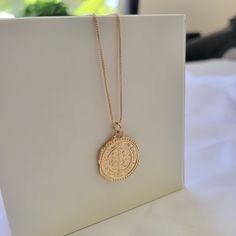 Round gold coin medallion necklace. Double sided imperfect medallion coin. Wear it on it's own or layer it. Pendant details: * Finish: non tarnish gold filled * Measurements: 1.1'H 0.75'WChain: non tarnish gold filledComes in our gift ready packaging: vegan leather pouch for safe jewelry storing and branded box Gold Bohemian Coin Pendant Necklace, Gold Bohemian Coin Necklace With Round Pendant, Bohemian Gold Coin Necklace With Round Pendant, Gold Plated Medallion Locket Necklace, Gold Plated Medallion Coin Necklace With Adjustable Chain, Gold Plated Medallion Necklace, Tarnish Resistant Gold Plated Medallion Necklace, Gold Amulet Charm Necklace With Coin Pendant, Gold-plated Medallion Chain Necklace With Coin Pendant