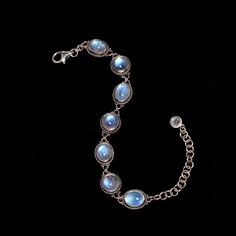 Sterling Silver Rainbow Moonstone bracelet, delicately designed & enhanced with opulent Moonstones, giving a sensual, feminine aura to this Elizabethan-inspired piece. Available in sizes 7 and 8. * Handcrafted in the finest .925 Sterling Silver. * Available in size 7:  6.5"-8" & size 8: 7"-9" * From my Mystic Moon Collection, featuring high-quality Rainbow Moonstones from India, fully-charged to enhance your intuition, provide protection & attract love. * Each natural gemstone is unique and may Luxury Natural Stones Bracelets, Elegant Moon-shaped Moonstone Jewelry, Elegant Moon Shaped Moonstone Jewelry, Luxury Oval Bracelet With Natural Stones, Luxury Oval Bracelets With Natural Stones, Elegant Moonstone Jewelry With Moon Phase Detail, Elegant Oval Jewelry With Moon Phase, Elegant Moon Phase Bracelet As A Gift, Elegant Silver Cabochon Bracelets