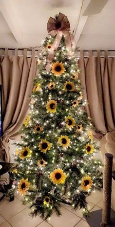 a decorated christmas tree with sunflowers and lights