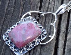 "Handmade, Natural Pink Thulite Sterling Silver Statement pendant on a Sterling Silver Chain. 🍓Featured in this listing is a sterling silver, handmade, LARGE natural stone pendant. This lovely handmade pendant features a large, beautiful, Natural Pink Thulite stone with a strawberry shortcake, pink and cream-ish tone coloration. It's beautiful 🍓 🍓The stone has been bezel set into a handmade, one of a kind Sterling Silver pendant. This Bali style pendant features fine silver wire work, detaile Silver Rhodonite Jewelry With Natural Stones, Sterling Silver Gemstone With Large Stone For Gifting, Silver Jewelry With Natural Stones And Rhodonite, Sterling Silver Gemstone With Large Stone For Gift, Unique Untreated Sterling Silver Gemstones, Artisan Sterling Silver Gemstone, Artisan Sterling Silver Gemstones With Large Stone, Elegant Rhodonite Jewelry Gift, Elegant Rhodonite Jewelry For Gifts