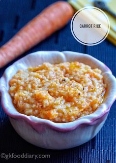 carrot rice in a small bowl next to a carrot on a blue tablecloth with the words carrot rice written above it