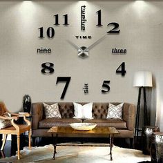 a living room filled with furniture and a large clock on the wall above it's face