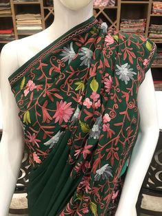 A Marvellous Embroidered Kashmiri Saree which you can wear at any party or a wedding.- - - - - - - - - - - - - - - - - - - - Product DetailsCondition: Brand NewKashmiri Saree with Multi-Colour Aari Embroidery.Colour: GreenF A B R I CSaree: Semi-CrepeBlouse: Semi-CrepeF I N I S H- UnstitchedYou can get it stitched locally.- StitchedWant your blouse ready to wear, let us know the style you want and we will stitch it for you.***PLEASE NOTE: We would require you to share certain precise body measure Green Salwar Kameez With Floral Embroidery, Festive Choli With Floral Embroidery, Festive Choli With Floral Embroidery And Traditional Drape, Semi-stitched Green Embroidered Fabric, Festive Choli With Floral Embroidery In Traditional Drape, Floral Embroidered Choli With Traditional Drape For Festive Occasions, Green Dress With Chikankari Embroidery In Traditional Drape, Green Dress With Chikankari Embroidery, Traditional Drape, Green Traditional Wear With Floral Embroidery For Diwali