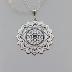 ★Item Details * Gender: Male / Female * Material:  925 Sterling Silver * Finish: Polished  * Chain : 925 Sterling Silver * Shipping: 2-5 days  * Handmade * Personalization: YES This unique silver necklace features a detailed design with three layers of 8 circles each, framed within an elegant lotus flower. Each petal of the lotus contains a circle, with an additional 8 circles in the center, and 8 more at the core. This intricate and meaningful design symbolizes harmony, balance, and spiritual a Etched Sterling Silver Necklaces, Silver Etched Sterling Silver Necklace, Spiritual Engraved White Gold Jewelry, Engraved Spiritual White Gold Jewelry, Engraved White Gold Spiritual Jewelry, Spiritual Sterling Silver Etched Necklaces, Spiritual Etched Sterling Silver Necklaces, Spiritual Etched Sterling Silver Necklace, Silver Etched Necklace With Flower Pendant