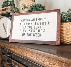 a sign that says having an empty laundry basket is the best five seconds of the week