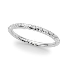 a white gold wedding band with diamonds