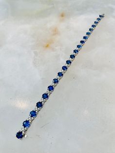 This 18K white gold bracelet features individual links set with round Blue Sapphires and White Diamonds. Sapphires total 5.58ctw in carat weight Diamonds total 1.71ctw in carat weight White Gold Bracelet, White Diamonds, White Diamond, Diamond White, Blue Sapphire, Diamond Bracelet, Gold Bracelet, Sapphire, Diamonds