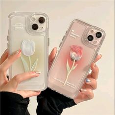 two women holding up their iphone cases with flowers on them