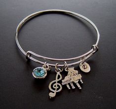 "Piano Musical Note Personalized Expandable Bangle Bracelet Hand Stamped Initial Birthstone,Silver Piano Musical Note charm, Music Bangle, Music Group gift - Antique Silver Piano Charm is 7/8\" x 5/8\"; -The Antique Silver Musical Note Charm is 26x10 mm; -The Antique Silver bangle is adjustable 2 1/2\" across and expands to 3\"; -The Antique Silver oval hand stamped Tag is 10x8mm; - Glass chaton crystal is set in antique silver bezel 7-11 mm - One Gift Box that show SAMPLE at 4th photo. ( color Music-themed Band Jewelry As Gift, Music-themed Band Jewelry Gift, Silver Music-themed Bracelets For Gifts, Silver Music-themed Bracelet As Gift, Music-themed Silver Bracelet As A Gift, Silver Music-themed Bracelet For Gift, Adjustable Silver Music-themed Bracelets, Silver Music-themed Charm Jewelry, Adjustable Silver Music-themed Bracelet