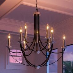 a chandelier hanging from the ceiling in a room