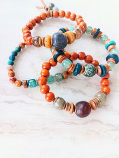 Beautiful mix of the southwestern color..rust, gold, pumpkin, browns, blue, sienna, touches of purple, green, and mustard. Lots of neutrals and tons of texture. Recycled glass, African bone beads, coconut disks, rustic wood, several Jasper and Agate varieties, Opal, Jade, sea shells, and more. Blended in with natural shell, fused glass, and bone beads. The item/s pictured is the item you will receive. Bracelets are 7.0" to 7.5" in length. Please let me know if you need a modification. This may d Earthy Turquoise Bracelets For Festival, Bohemian Turquoise Beaded Bracelets For Everyday, Everyday Bohemian Turquoise Beaded Bracelets, Earthy Multicolor Beaded Bracelets With Natural Stones, Earthy Multicolor Beaded Bracelet With Natural Stones, Earthy Multicolor Bracelet For Festival, Earthy Multicolor Bracelets For Festivals, Turquoise Bohemian Bracelet For Everyday, Turquoise Bohemian Bracelets For Everyday