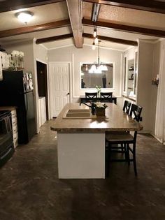 the kitchen is clean and ready to be used for cooking or dining room furniture, as well as new appliances