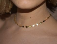 Simple & sweet star choker. One size fits all. About 12.5in-16in adjustable. If you are concerned with the size feel free to leave your measurements when you check out. Necklace is made of gold plated copper. Water, lotion, fragrances, sweat (any kind of moisture) can cause discoloration. Shipped with minimal packaging to avoid unnecessary waste. ♥️🌎 Check out our hanging stars choker here: https://etsy.me/2HiGzhi Check out our star gemstone here: https://etsy.me/31pUk68 Check out out our s Cute Adjustable Choker Jewelry, Adjustable Dainty Star Jewelry, Trendy Star Charm Choker, Cute Gold Choker Jewelry, Trendy Adjustable Jewelry With Star Charm, Trendy Adjustable Star-shaped Necklace, Cute Adjustable Jewelry With Star Charm, Trendy Adjustable Star Necklaces, Adjustable Star Choker