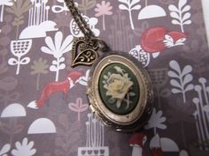 "**AT FANCY FOX your satisfaction is our number one goal. I will keep you informed of your item and when it ships as well as leave positive feedback for you. Please do the same for me - Please let me know when your item arrives and leave positive feedback for me. The locket is 1 inch long x 3/4 inch wide the locket is right at one inch long one inch wide. It does come with a free 17\" chain but I can shorten it if you need me to **thank you for taking the time to look at our items. Each item is Cherokee Rose, Graduation Presents, Scottish Thistle, Cameo Necklace, Silver Lockets, Antique Roses, Fairy Angel, Victorian Jewelry, Fun To Be One