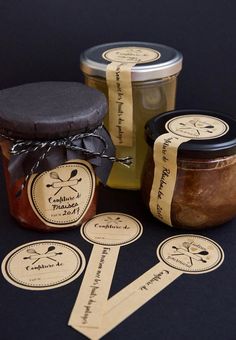 three jars of jam with labels on them