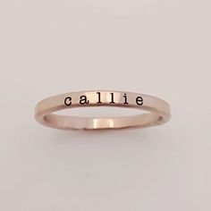 Add a touch of individuality to your jewelry collection with the Typewriter Name Ring from Going Golden. Handcrafted in Brownsburg, Indiana, this ring is perfect for those who love a classic, typewriter-style font. Available in 14K gold-filled, fine silver, or rose gold, this ring offers 100x more solid gold than plated alternatives, ensuring it’s waterproof and tarnish-resistant. Each ring comes with a polishing pad and a gift box, making it a thoughtful gift for someone special or a delightful Classic Stackable Rose Gold Initial Ring, Classic Rose Gold Stackable Initial Ring, Hand Stamped 14k Gold Engraved Ring, Classic Adjustable Initial Ring In Rose Gold, Minimalist Hand Stamped Yellow Gold Ring, Classic Engraved Rose Gold Ring For Everyday, Everyday Rose Gold Initial Ring In Sterling Silver, Classic Rose Gold Engraved Ring For Everyday, Classic Rose Gold Sterling Silver Stackable Rings