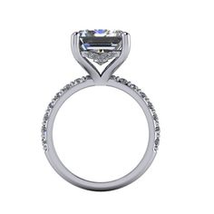 Emerald Cut Colorless Moissanite engagement ring shown with a 12x10mm, 6.77 ct Emerald Cut Colorless Moissanite, DEF Color, VVS Clarity. Round Side Stones - 2mm round lab grown diamonds, GH Color, SI1 Clarity, .76 ctw. Engagement Ring Band width 2.2mm. *7.53 carat total weight. *The ring is custom made just for you in your ring size and metal preference.*Please contact us prior to purchasing with any questions, we are happy to help. Mens Gemstone Rings, Emerald Cut Moissanite, Rings Mens Wedding Bands, Traditional Diamond, Moissanite Necklace, Forever One Moissanite, Moissanite Earrings, Band Engagement Ring, Dream Engagement Rings