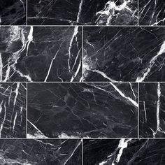 black and white marble tiles are arranged in an abstract grid pattern, with different angles