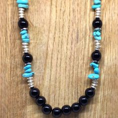 Adorn yourself with a stunning 27-inch onyx, silver, and turquoise necklace that represents the powerful inner strength within you. It's a beautiful contrast that symbolizes your resilience and fortitude as it transforms your style and look. Southwestern Black Round Bead Necklaces, Southwestern Black Necklace Ideal For Gifts, Southwestern Style Black Necklace For Gift, Southwestern Style Black Necklaces For Gifts, Southwestern Style Black Necklace For Gifts, Inner Power, Inner Strength, Nature Jewelry, Wearable Art