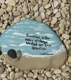 there is a rock with a quote on it