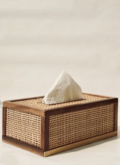 a tissue dispenser sitting on top of a table