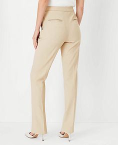 Elevate your wardrobe with the Ann Taylor Side Zip Straight Pant in Bi-Stretch, a testament to timeless style and comfort. This piece redefines sophistication with its straight-leg silhouette that skims the legs for a tailored, chic look. Perfect for both office and evening wear, these pants ensure you remain polished throughout the day.

- **Size:** 18 Regular
- **Color:** Toasted Oat
- **Material:** 66% Polyester, 28% Rayon, 6% Spandex
- **Fit:** Tailored and fitted
- **Rise:** High rise; sits Classic Cream Straight Leg Dress Pants, Elegant Khaki Straight-leg Bottoms, Khaki Non-stretch Straight Leg Pants, Beige Straight Pull-on Pants, Pull-on Straight Leg Elastane Pants, Knitted Suit, Plaid Tie, Tie Neck Tops, Wide Leg Cropped Pants