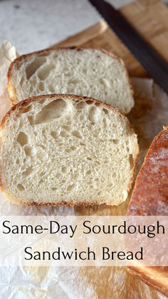 two slices of sourdough sandwich bread sitting on top of a cutting board with the words same - day sourdough sandwich sandwich bread