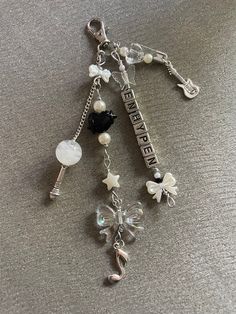 a key chain with charms attached to it