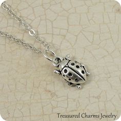 This Ladybug Charm necklace comes on a silver-plated chain that is available in different lengths. Please choose your desired length from the drop-down menu when placing the item in your shopping cart. { CHARM DETAILS }★ Material: Pewter ★ Finish Color: Silver★ Measurements: 1/4" x 1/2"★ Dimensions: 3-Dimensional★ Made in the USA{ SIMILAR ITEMS } More bug and insect items available from my shop: https://www.etsy.com/shop/treasuredcharms/search?search_query=insect{ GIFT OPTIONS}Gift boxes are ava Adjustable Themed Silver Charm Necklaces, Adjustable Silver Themed Charm Necklaces, Themed Adjustable Silver Charm Necklaces, Themed Sterling Silver Nickel Free Necklaces, Themed Sterling Silver Nickel-free Necklace, Themed Sterling Silver Necklace, Themed Sterling Silver Necklace In Silver, Ladybug Beetle, Beetle Necklace