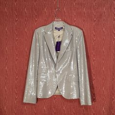 Ralph Lauren Purple Label Silver Gray Sequin Blazer I Button Women's Sz 6 I Button Closure Logo-Print Lining Sequin Embellishment Pearl Gray Two Front Flap Pockets Single Breasted Great For A New Years Party Great For A Christmas Gift Great Love Myself Gift Etc... Accepting All Reasonable Offers Or Best Offer So Feel Free To Make A Offer Or Counter Offer Because I Might Just Accept It Elegant Metallic Long Sleeve Blazer, Luxury Silver Outerwear For Parties, Fitted Silver Blazer For Evening, Elegant Silver Blazer For Evening, Elegant Silver Evening Blazer, Elegant Silver Blazer For Workwear, Elegant Silver Blazer For Work, Elegant Silver Sequined Outerwear, Silver Winter Formal Blazer