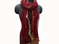 Pattern - an embroidered scarf. Ideal for -  women/ girls. Occasion -   formal or casual.  Fabric - fine net, has a fine texture with a nice fall. Color - maroon with golden thread and foil sequin embroidery.  Size - 38 x 80 inches approx.  Can be wrapped in different styles. Care - gentle hand wash. Elegant Festive Scarves With Zari Work, Elegant Scarves With Zari Work For Festive Season, Elegant Scarves For Eid Festival, Gift Embroidered Shawl Dupatta, Elegant Festive Scarves For Eid, Elegant Shawl For Parties And Festivals, Elegant Wedding Scarves For Festivals, Elegant Red Scarf For Festive Season, Festive Shawl-shaped Dupatta Scarf