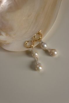 "These earrings feature a mini hoop that hugs the earlobe and two genuine baroque freshwater pearls. They make a great statement while still being comfortable to wear. Wear them two ways - slide the dangle off to wear just the simple hoop earring. Materials: 14K gold fill or sterling silver Earring: 14k gold fill or sterling silver hoop with secure latch hook Measures: approx. 2\" in length Handmade in New York Arrives perfectly packaged, ready for gift-giving! Due to the nature of pearls, each Elizabeth Jewelry, Interchangeable Earrings, Simple Hoop Earrings, Silver Wedding Jewelry, Freshwater Pearl Jewelry, Back Necklace, Baroque Pearl Earrings, Mini Hoop Earrings, Pearl Hoop Earrings