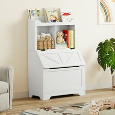 a white book shelf with books and toys on it