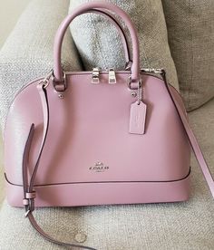 Coach Crossgrain Sierra Satchel Shoulder Handbag PINK Patent Crossgrain Leather Inside cell phone and multifunction pockets Zip closure, fabric lining Handles with 4 1/4" drop Outside slip pocket Detachable strap with 21 1/2" for shoulder or crossbody wear 13 1/2" (L) x 9 1/2" (H) x 4 3/4" (W) Style No. F31352 Like new. No tags. No notable flaws.  Msrp $428. Excellent condition. Gorgeous. Sold out in this color. No dustbag.smoke and pet free home. Guaranteed authentic. No lowball offers plse. Classic Pink Rectangular Bag, Classic Pink Bag With Dust Bag Included, Pink Handheld Bag For On-the-go, Designer Pink Shoulder Bag For On-the-go, Designer Pink Crossbody Bag, Designer Pink Satchel For Travel, Luxury Pink Bag For On-the-go, Pink Satchel For Everyday, Classic Pink Rectangular Satchel