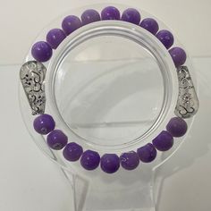 Purple with sliver bracelet Elegant Purple Round Crystal Bracelet, Elegant Round Purple Crystal Bracelet, Elegant Lavender Beaded Bracelets With Faceted Beads, Elegant Lavender Beaded Bracelet With Faceted Beads, Adjustable Elegant Purple Crystal Bracelet, Elegant Purple Crystal Bracelet For Healing, Elegant Purple Stretch Bracelet For Party, Adjustable Purple Beaded Bracelet With Silver Beads, Purple Stretch Bracelet With Round Beads For Party