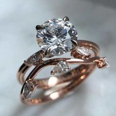 a close up of a diamond ring on a table