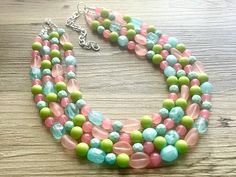 "Bright & fun coral and green statement necklace! We love this dreamy color palette with ANY shade of blue, yellow, or red. It is also beautiful with a white tee! 16\" necklace with a 4\" extender chain. Earrings are a matching bead in a drop style. Thank you for supporting American small business :) *Smoke and pet free home!* I ship 6 days a week! Thank you for browsing my store, Check out my other items!" Green Round Beads Necklaces For Spring, Handmade Green Beaded Necklace For Spring, Green Necklaces With Round Beads For Spring, Spring Green Necklace With Round Beads, Beaded Necklace Blue, Coral And Green, Green Statement Necklace, Pink Statement Necklace, 16 Necklace