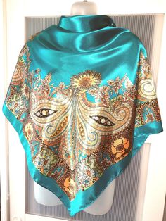 Absolutely gorgeous teal green and blue/turquoise large square silk satin scarf that will add riches to your outfit! The scarf is designed in the best oriental traditions with red and orange paisley design. The shawl can be used for a very special occasion like an engagement or wedding celebration! The color of the scarf is between teal green and teal blue depending on the light. No tag is attached, however the scarf is in excellent/mint condition and comes in a gift wrap and with a 'Thank you' Blue Satin Silk Scarf As Gift, Blue Satin Silk Scarf For Gift, Blue Satin Scarves, Blue Square Scarves For Gifts, Blue Square Scarves As Gift, Blue Shawl Scarf For Gift, Teal Scarf, Large Square Scarf, Satin Scarf