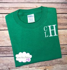 "These monogrammed t-shirts are made of a comfortable cotton fabric, making a casual, yet stylish, addition to the wardrobe of any boy. I offer boys t-shirts using four different styles of fonts. Shirts ordered from this listing will be monogrammed using a stacked font as shown in the listing picture. The order of the letters will be FIRST NAME as the top, small letter, MIDDLE NAME as the bottom small letter, and LAST NAME as the large letter. IMPORTANT: When placing your order please provide th Cute Cotton T-shirt With Name Print, Customizable Basic Cotton Shirt, Customizable Long Sleeve Green T-shirt, Customizable Green Long Sleeve T-shirt, Family Matching Cotton T-shirt With Name Print, Green Cotton Shirt With Name Print, Cute Green Tops With Name Print, Personalized Short Sleeve Cotton Shirt, Personalized Cotton Short Sleeve Tops