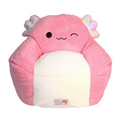 a pink stuffed animal chair with wings on it's head and eyes, sitting in front of a white background