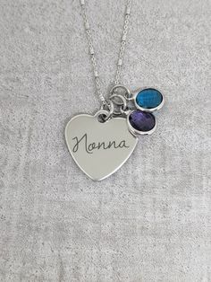 "A sterling diamond cut necklace with a stainless steel heart shaped message charm that reads, \"nonna,\" with crystal birthstone charms. Chains are available in both 18 and 20 inches. To order: Please choose the number of birthstones from the drop down box and leave the coordinating months in the personalization box. All items arrive boxed and ready for gift gift giving." Diamond Cut Necklace, Mother's Day Jewelry, Necklace Birthstone, Family Necklace, Jewelry Personalized, Birthstone Charms, Birthstone Necklace, Diamond Cut, Jigsaw Puzzle