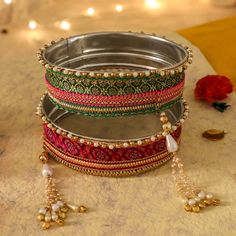 A specially curated Chalni for the auspicious celebration of Karwa Chauth, this Chalni is handmade with pure rawsilk fabric with golden & pearl colored beads that look absolutely elegant. Standard Chalni - 6.5 inches in diameter Gift this Pooja thali along with chalni for your wife who would be keeping a fast for you on the festive occasion of Karwa Chauth Karva Chauth Chalni Decoration, Thali Decoration, Silk Bangles, Birthday Flowers Bouquet, Pooja Thali, Festivals Of India, Raw Silk Fabric, Golden Pearl, Potli Bags