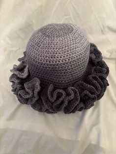 Ruffle hat, variegated yarn, so each hat is different. Fits most women from a smoke-free home. Very stylish and unique hat perfect for any occasion. Gray Crochet Hat, One Size Fits Most, Gray Crochet Hat One Size, Hand Knitted Sun Hat One Size Fits Most, One Size Yarn Cloche Hat With Short Brim, Yarn Cloche Hat One Size Fits Most, Gray Hand Knitted Hat, One Size Fits Most, Handmade Gray Hat One Size, Handmade Gray Hats One Size, Gray Hand Knitted Hat, One Size