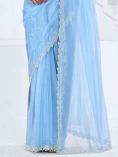 This saree is crafted from luxurious organza material in a captivating sky-blue color with intricate Swarovski work all over. The saree is adorned with a heavy handwork border, adding a touch of sophistication and elegance to the overall look. Paired with a matching organza blouse featuring zircon work, this ensemble is perfect for receptions, parties, festivals, or any special occasion.
This saree includes its gorgeous sky-blue color that exudes charm and elegance. The Swarovski work all over t Designer Blue Tissue Silk Pre-draped Saree, Blue Tissue Silk Pre-draped Designer Saree, Blue Tissue Silk Pre-draped Saree For Designer Wear, Blue Organza Pre-draped Saree With Dupatta, Festive Blue Wedding Pre-draped Saree, Blue Tissue Silk Blouse Piece For Party, Blue Bollywood Style Pre-draped Tissue Silk Saree, Bollywood Style Blue Pre-draped Saree With Resham Embroidery, Blue Organza Pre-draped Saree With Pallu