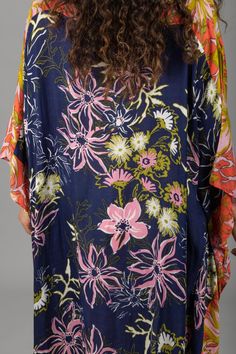 Our lovely Wildflower Kaftan showcases a range of floral motifs and delicate botanical elements in varying sizes and styles. The cinched sides of the garment create a unique drape that flatters all body types, enhancing natural beauty and complementing individual styles. The design also allows for easy movement, ensuring maximum comfort throughout the day. This kaftan, made from lightweight material, is the perfect choice for a luxurious and stylish outfit, whether you're lounging by the pool or Casual Floral Dress With Vibrant Print For Brunch, Multicolor Printed Floral Dress For Day Out, Printed Multicolor Floral Dress For Day Out, Multicolor Floral Dress With Vibrant Print For Summer, Multicolor Summer Floral Dress With Vibrant Print, Multicolor Tropical Print Floral Dress For Vacation, Multicolor Tropical Print Summer Floral Dress, Patterned Dresses With Kimono Sleeves For Summer, Spring Dresses With Hibiscus Print And Short Sleeves